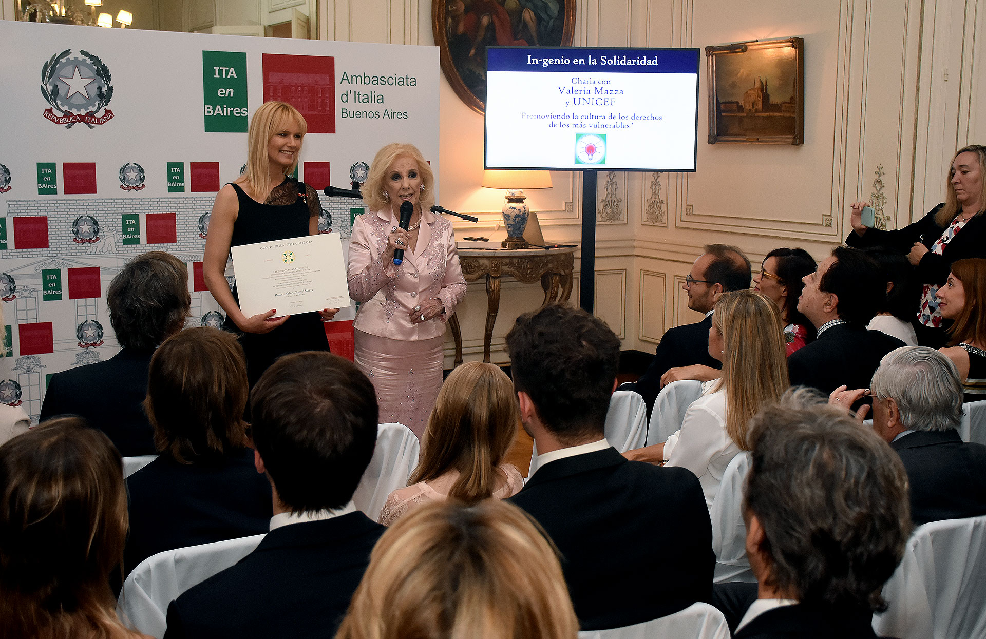 Valeria Mazza y Mirtha Legrand. In-genio en la Solidaridad es parte del ciclo In-genio italiano, cuyo propósito es celebrar el ingenio que continúa inspirando al mundo en su camino hacia el progreso en el arte y la empresa, la tecnología y la literatura, la música y la innovación, la arquitectura y la ciencia. Se trata del mismo “genio e ingenio” que contribuyó a la creación de la Argentina, que conocemos y que la acompaña hoy en la construcción de su futuro