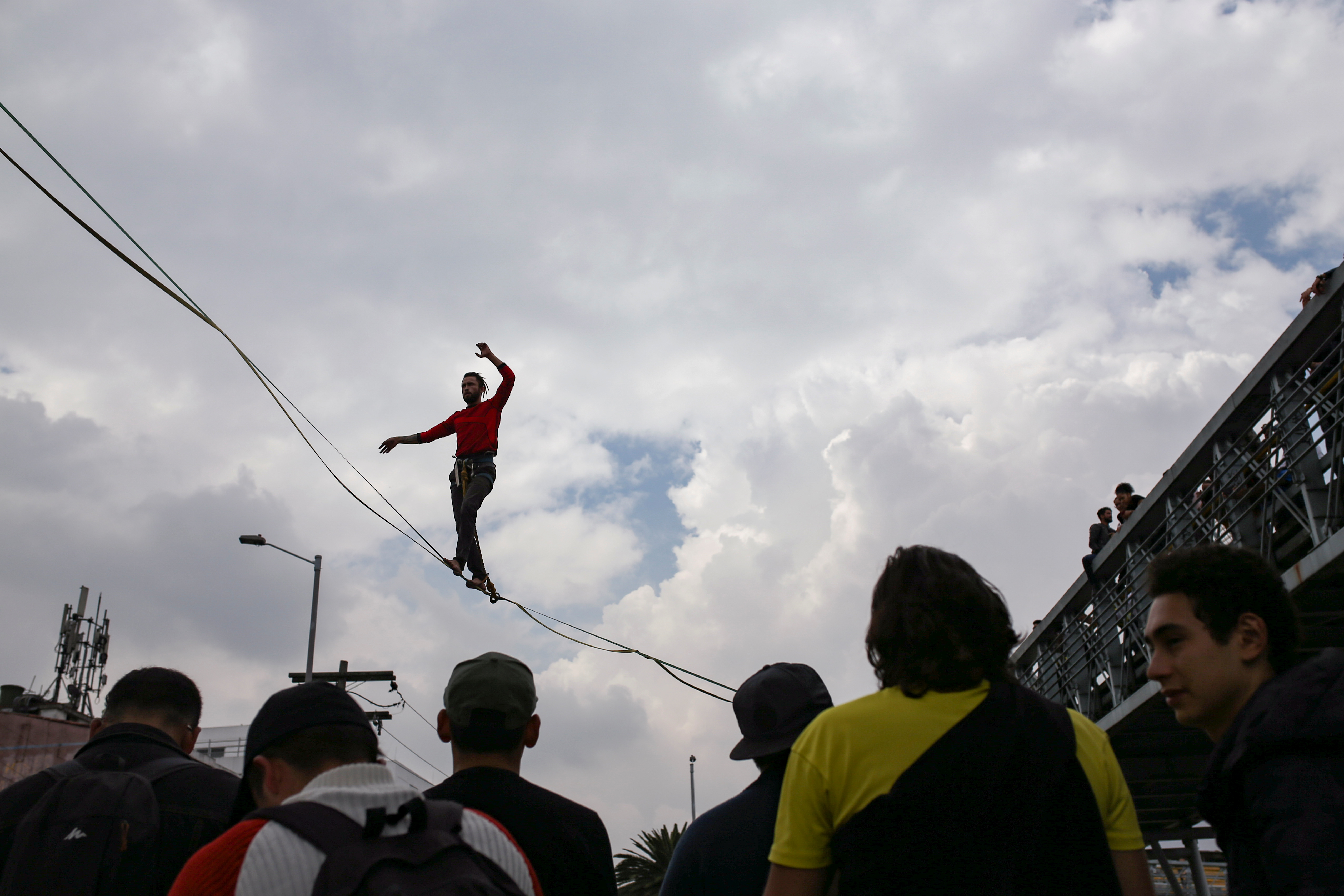 A man walks on a tightrope during a protest for a national strike, in Bogota, Colombia, November 21, 2019. REUTERS/Luisa Gonzalez