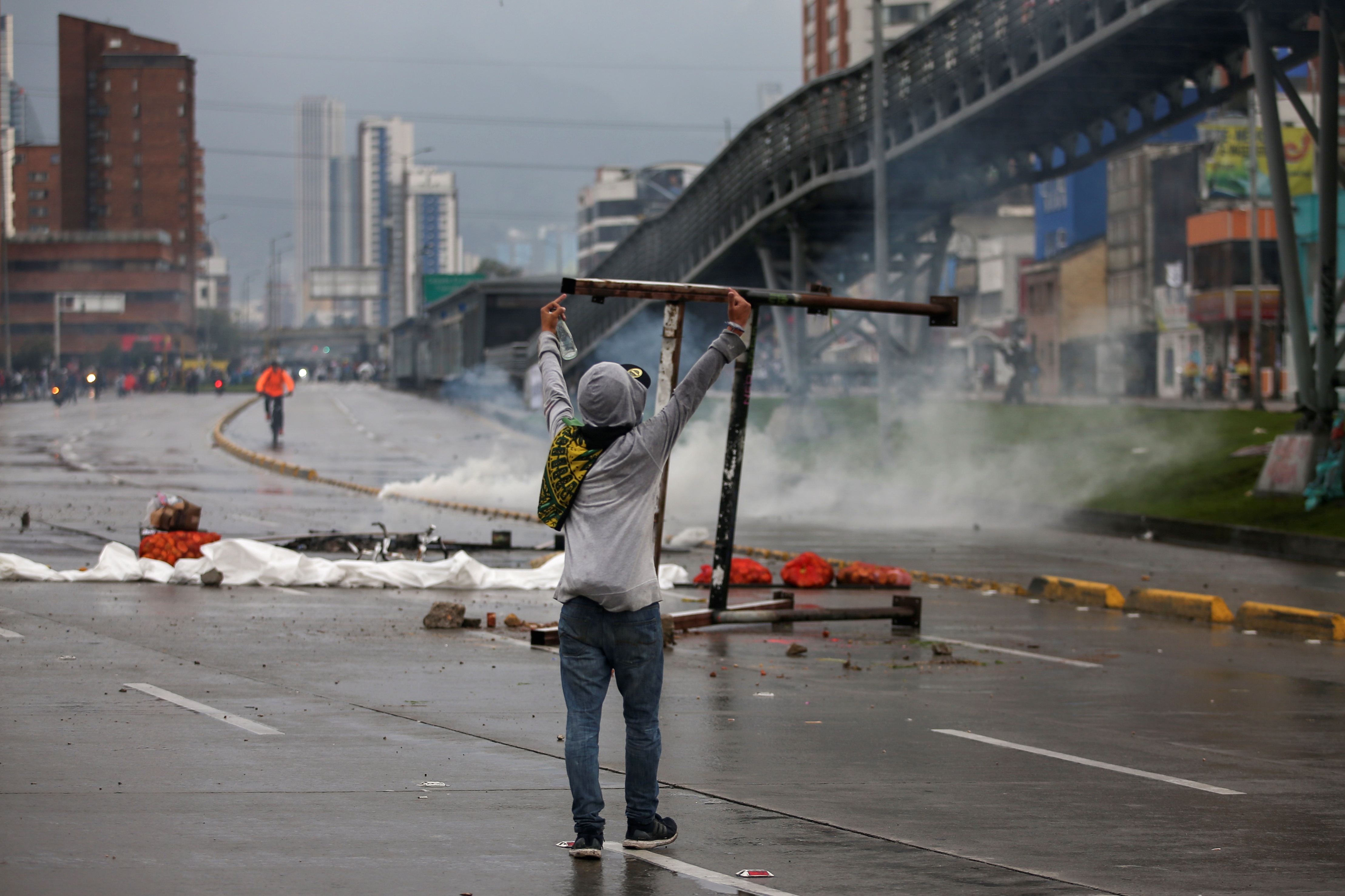 A demonstrator gestures to riot police during a protest in Bogota, Colombia, November 21, 2019. REUTERS/Luisa Gonzalez