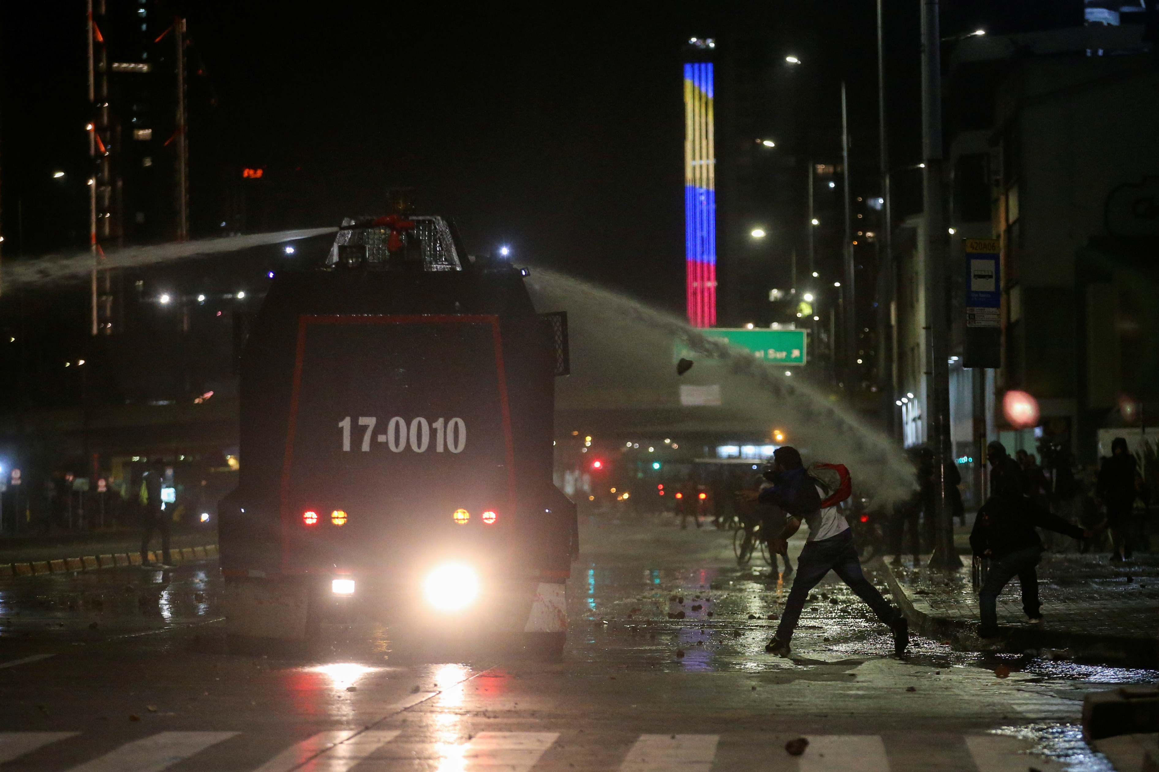 A riot police vehicle uses a water cannon to disperse demonstrators during a protest in Bogota, Colombia, November 21, 2019. REUTERS/Luisa Gonzalez