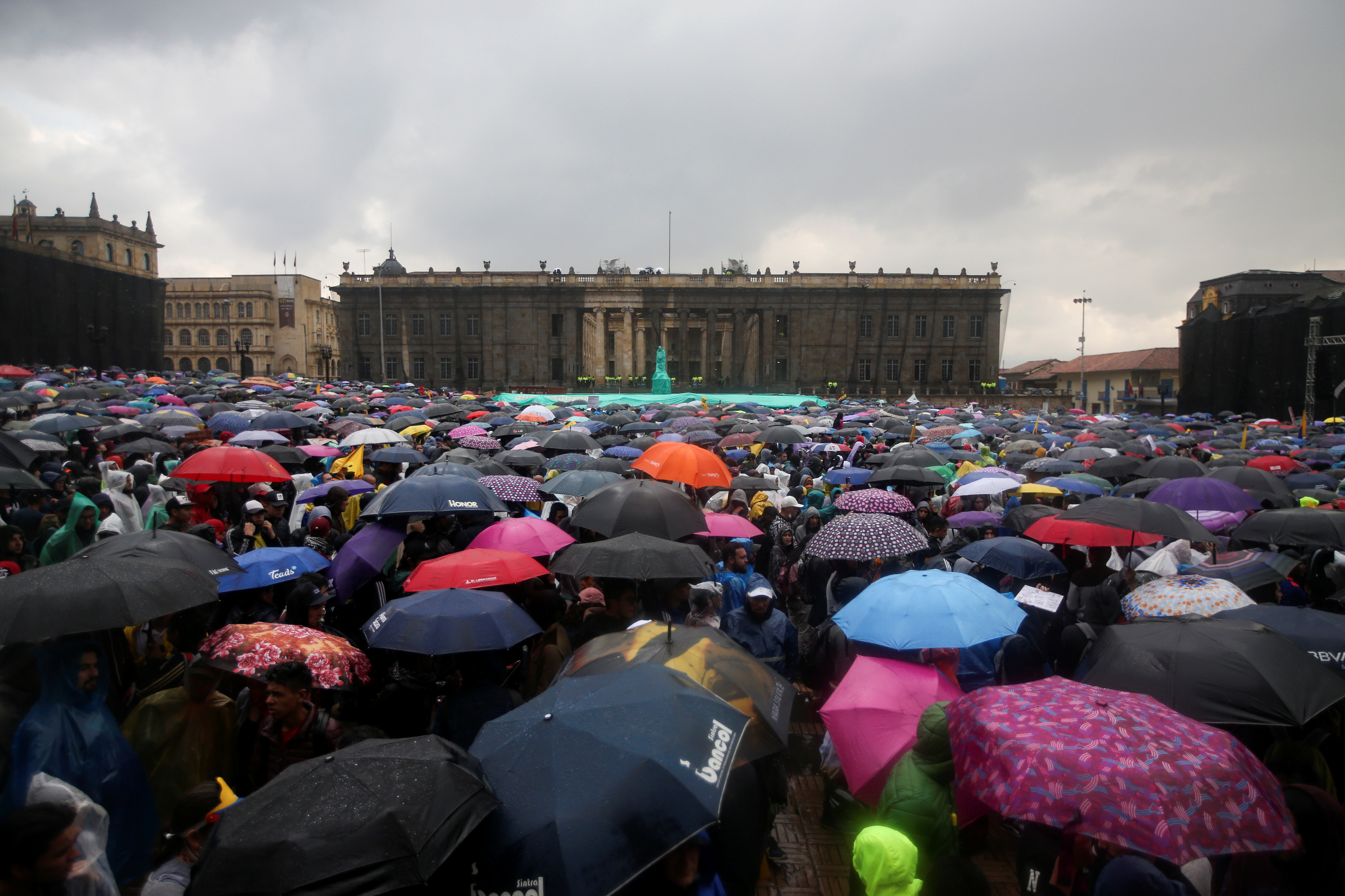 Demonstrators hold umbrellas as they take part in a protest in Bogota, Colombia, November 21, 2019. REUTERS/Luisa Gonzalez