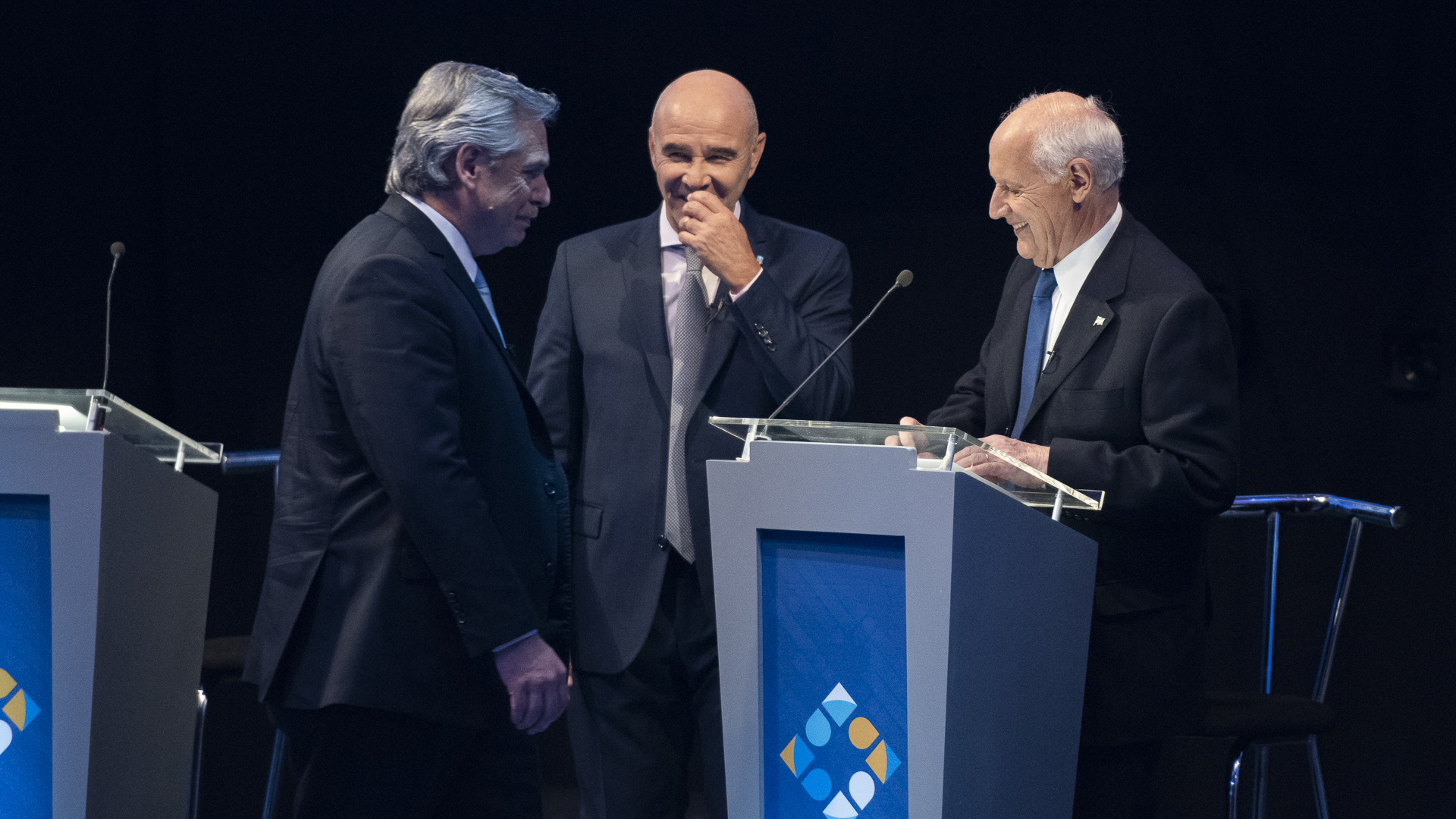 Alberto Fernández, Juan José Gómez Centurión y Roberto Lavagna durante uno de los cortes del debate