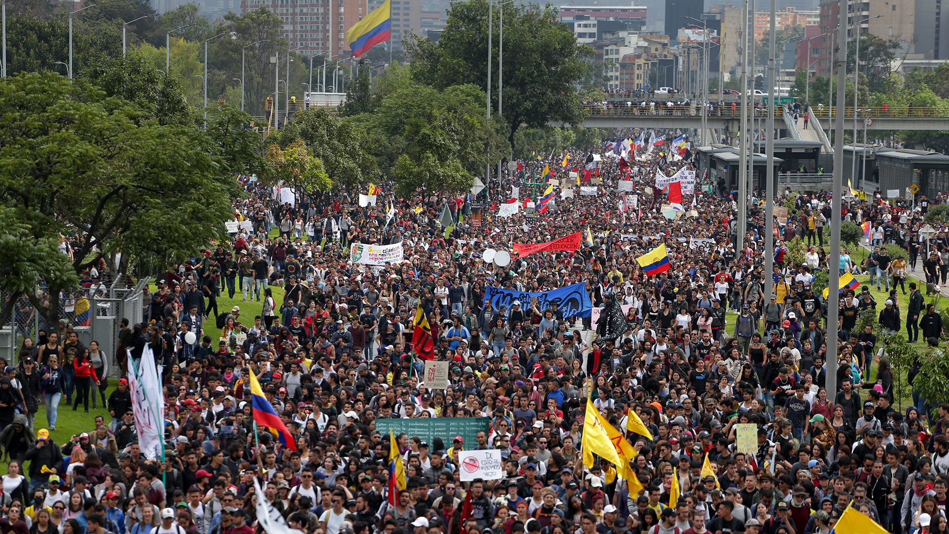 Anti-government demonstrators march during a nationwide strike in Bogota, Colombia, Thursday, Nov. 21, 2019. Colombia's main union groups and student activists called for a strike to protest the economic policies of Colombian President Ivan Duque government and a long list of grievances. (AP Photo/Ivan Valencia)