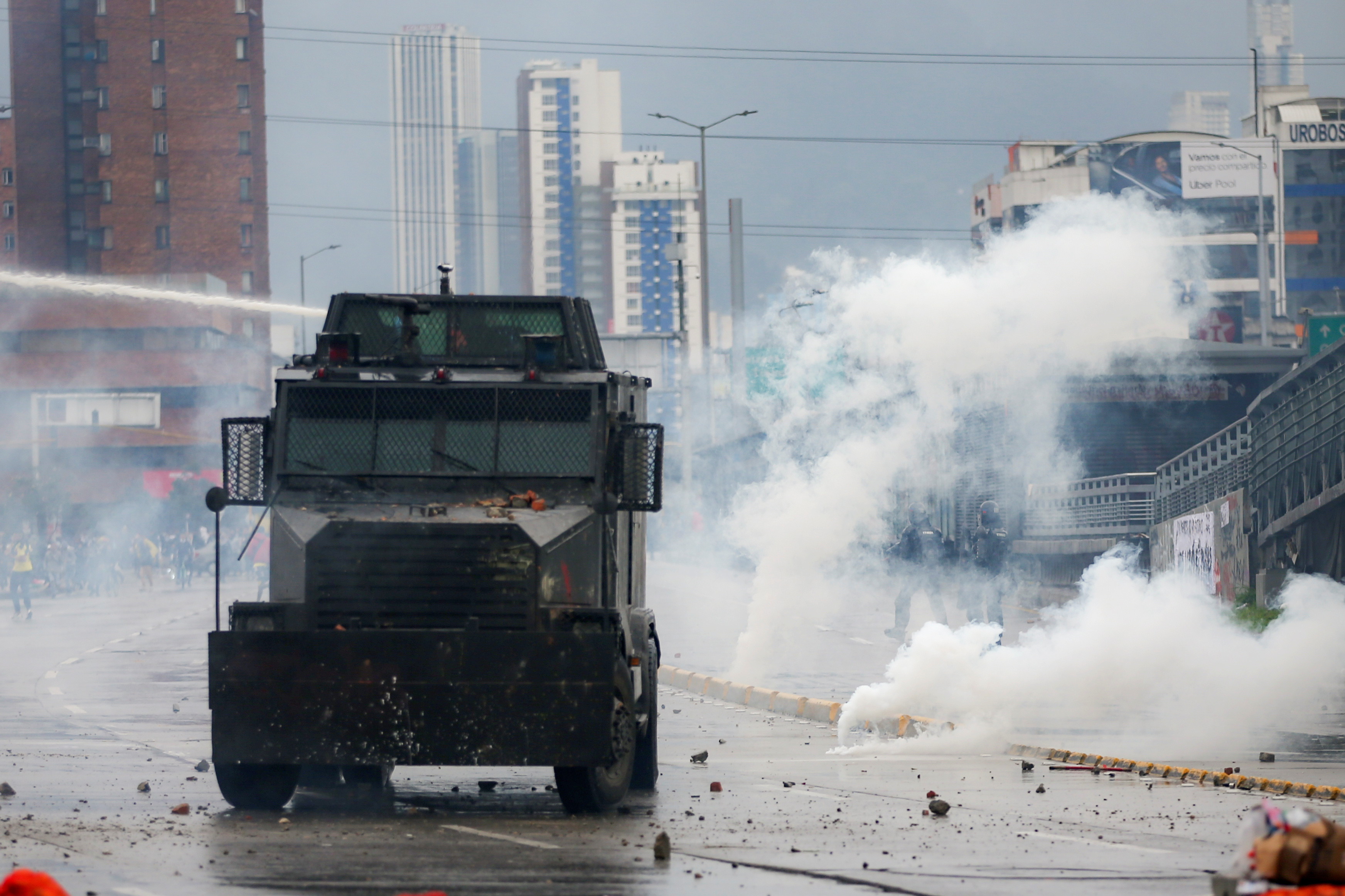 A riot police vehicle uses a water cannon to disperse demonstrators during a protest in Bogota, Colombia, November 21, 2019. REUTERS/Luisa Gonzalez