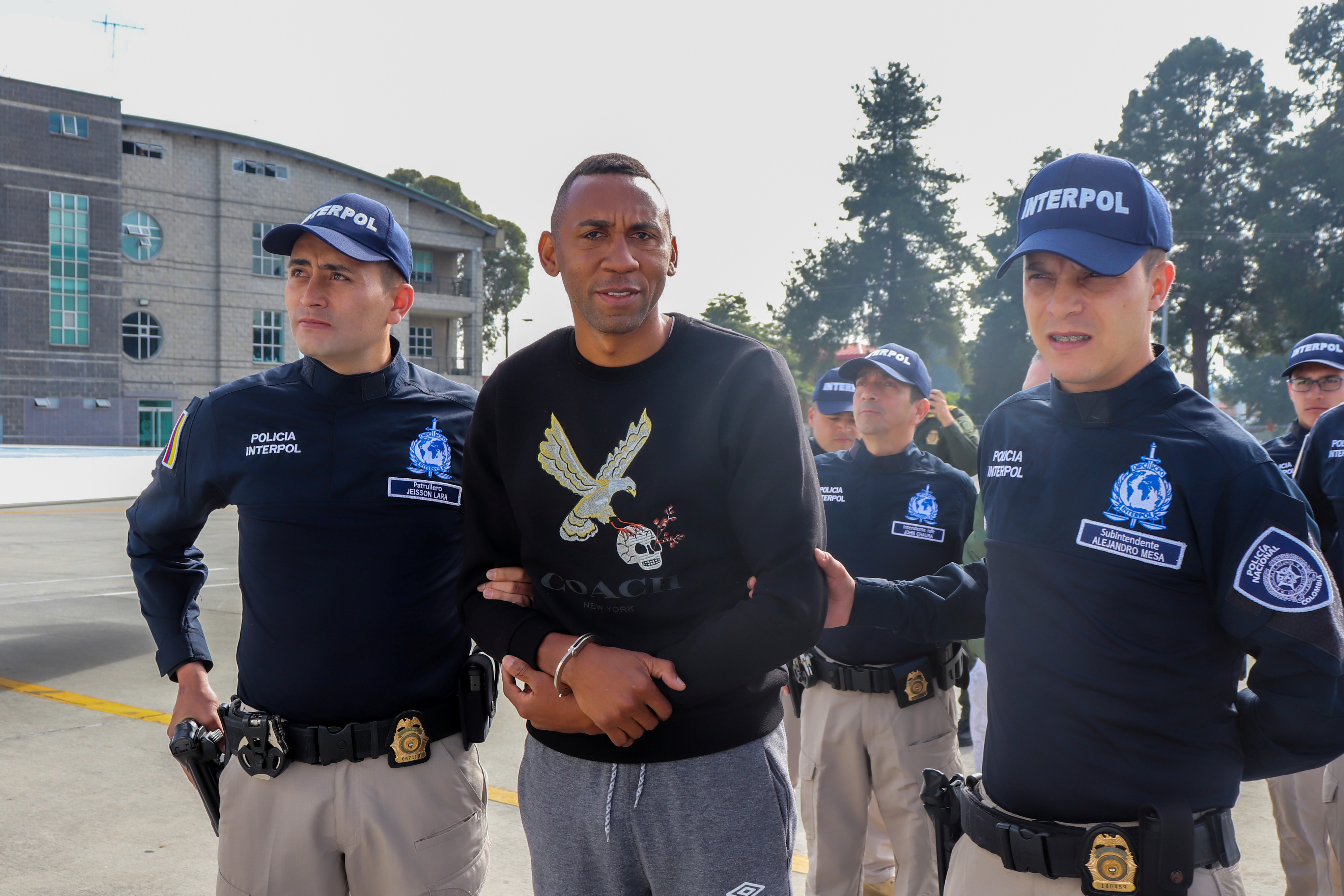Colombia's former soccer player Jhon Viafara, is escorted by the police, before being extradited to the U.S., to answer for alleged drug trafficking crimes, at an airport in an anti-narcotics base in Bogota, Colombia January 23, 2020. Colombian Police/Handout via REUTERS ATTENTION EDITORS - THIS IMAGE WAS PROVIDED BY A THIRD PARTY
